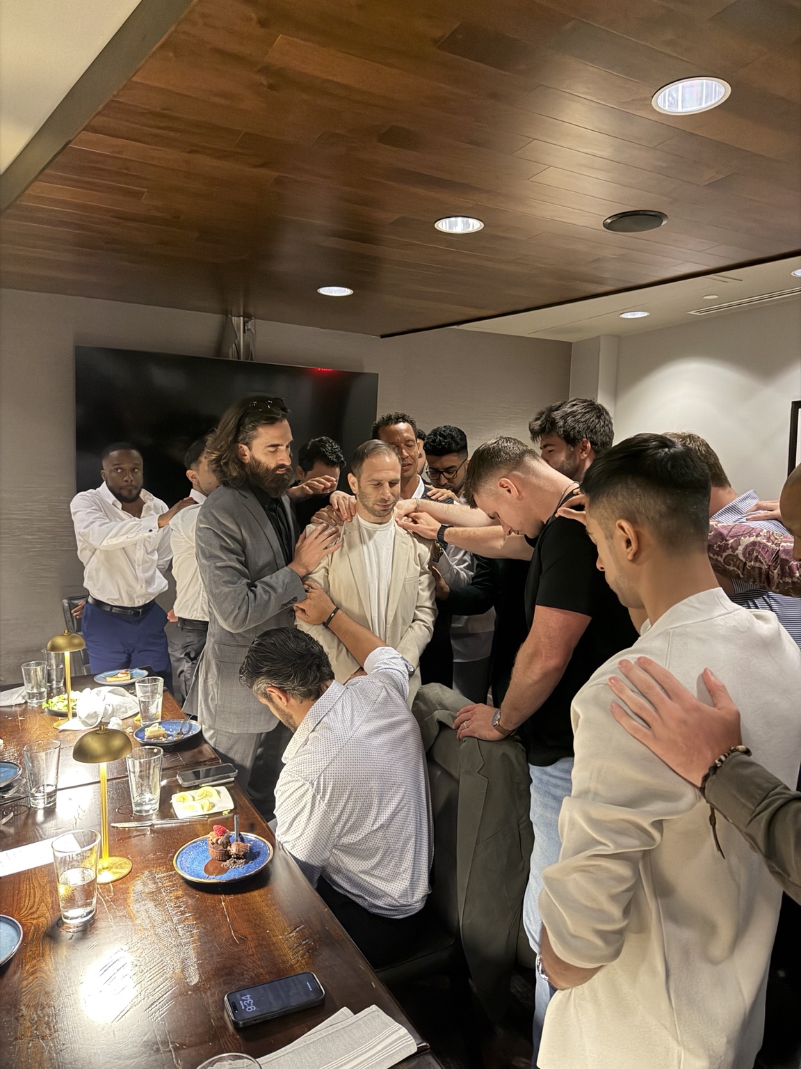 LCL members gathered together around a dinner table