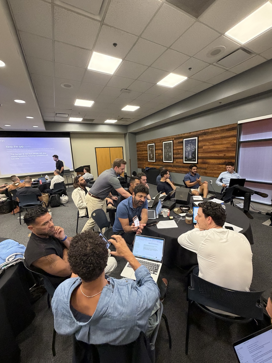 LCL members working together around tables during a workshop